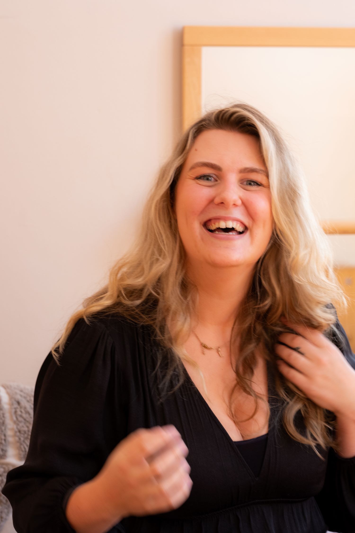 frontal portrait, blonde woman, smiling, natural light